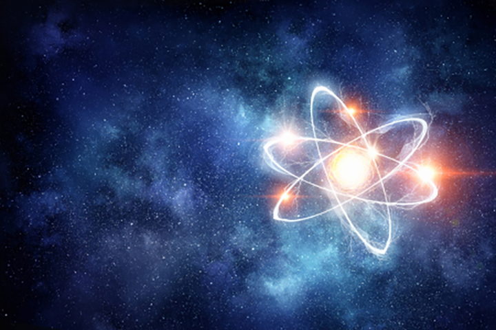 Glowing atomic symbol against a dark background
