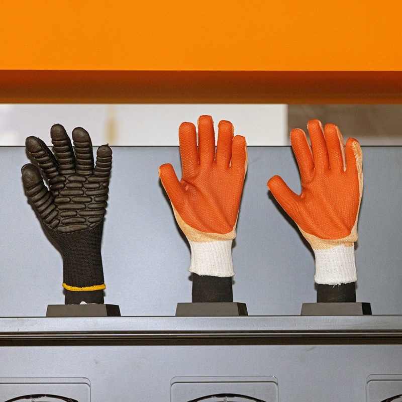 Heavy Duty Work Gloves in black and orange on a shelf