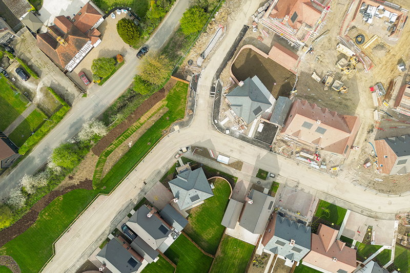 Stock image of a housing development being built next to existing developments