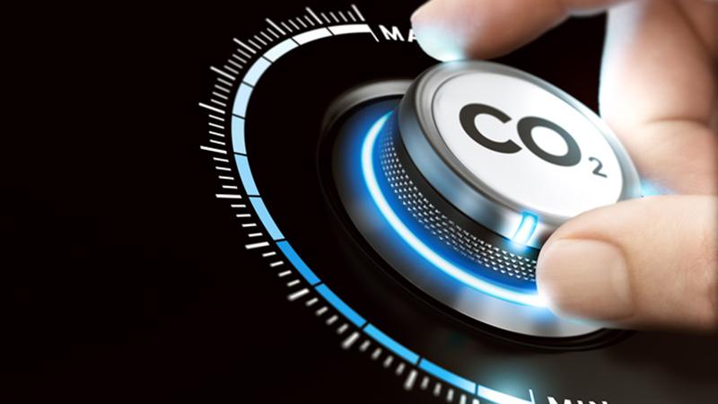 A dal labelled CO2 with fingers turning the dial