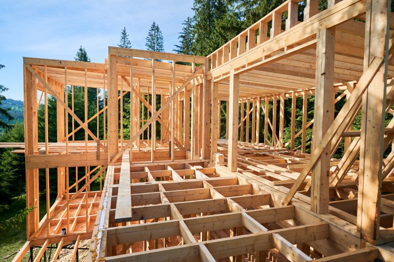Under-construction residential wooden frame building. Initiation of new construction project for mountain cottage.