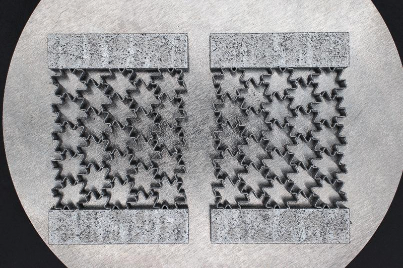 Samples of a seed-coat-inspired, nickel-titanium metamaterial prepared for testing 