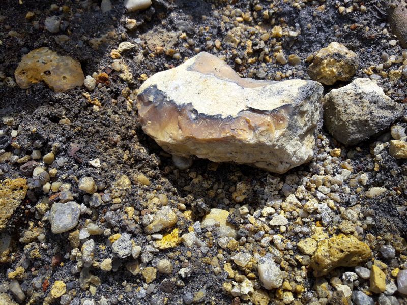 The Lac Tio (Havre St-Pierre) mines Titanium. Titanium ore features in the image in the form of small pieces with admixtures of silicon fragments.