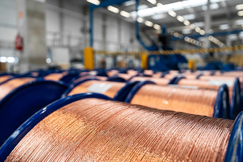 Large spools of copper in a warehouse