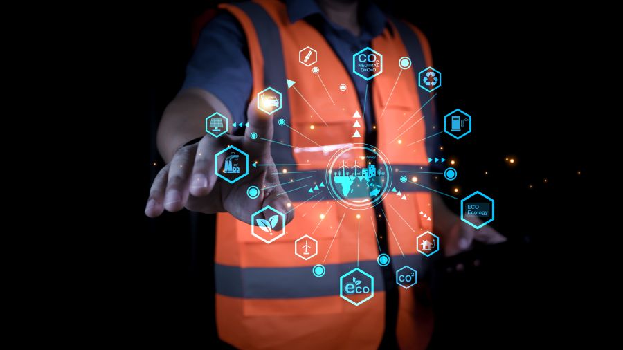 Professional engineer touching virtual interface for net zero and carbon neutral concept. Sustainable industrial development showing green energy technology icons on dark background