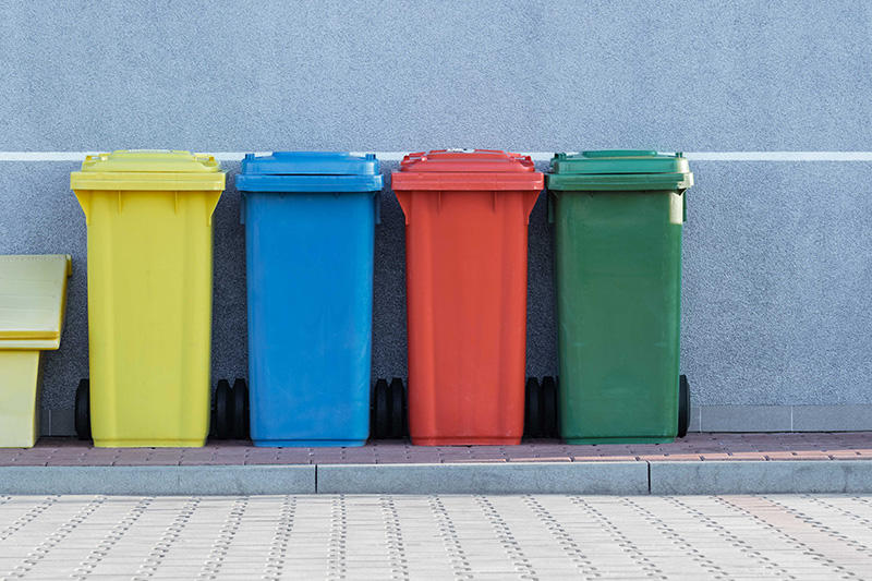 Different coloured recycling bins